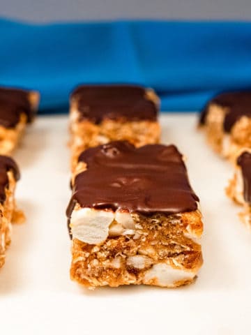 Peanut Butter S'mores bars on a white surface.