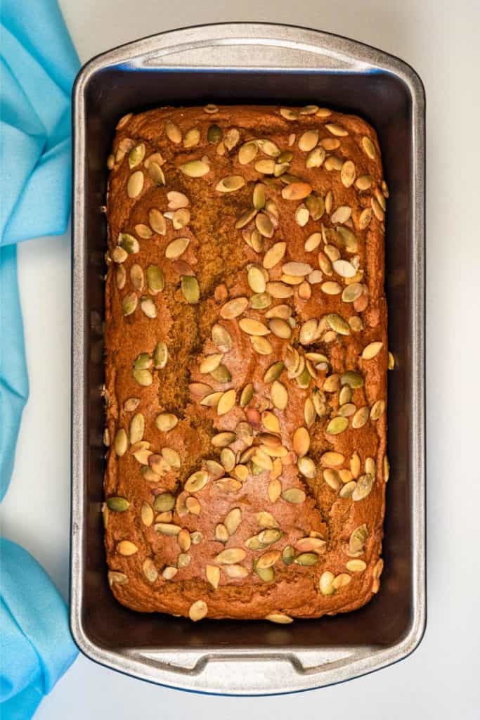 A loaf of vegan pumpkin bread in the tin.