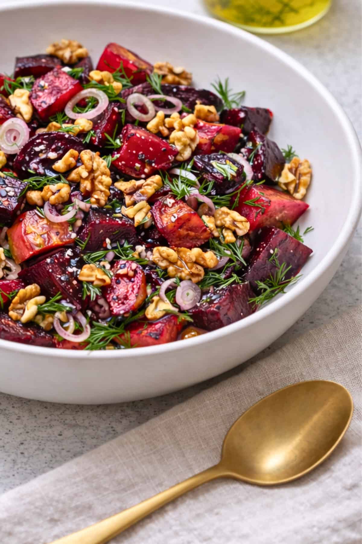 beet and walnut salad in a white bowl
