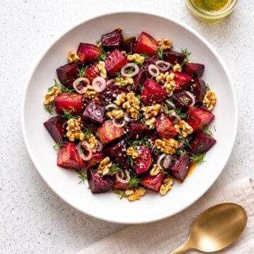 beet and walnut salad in a white bowl