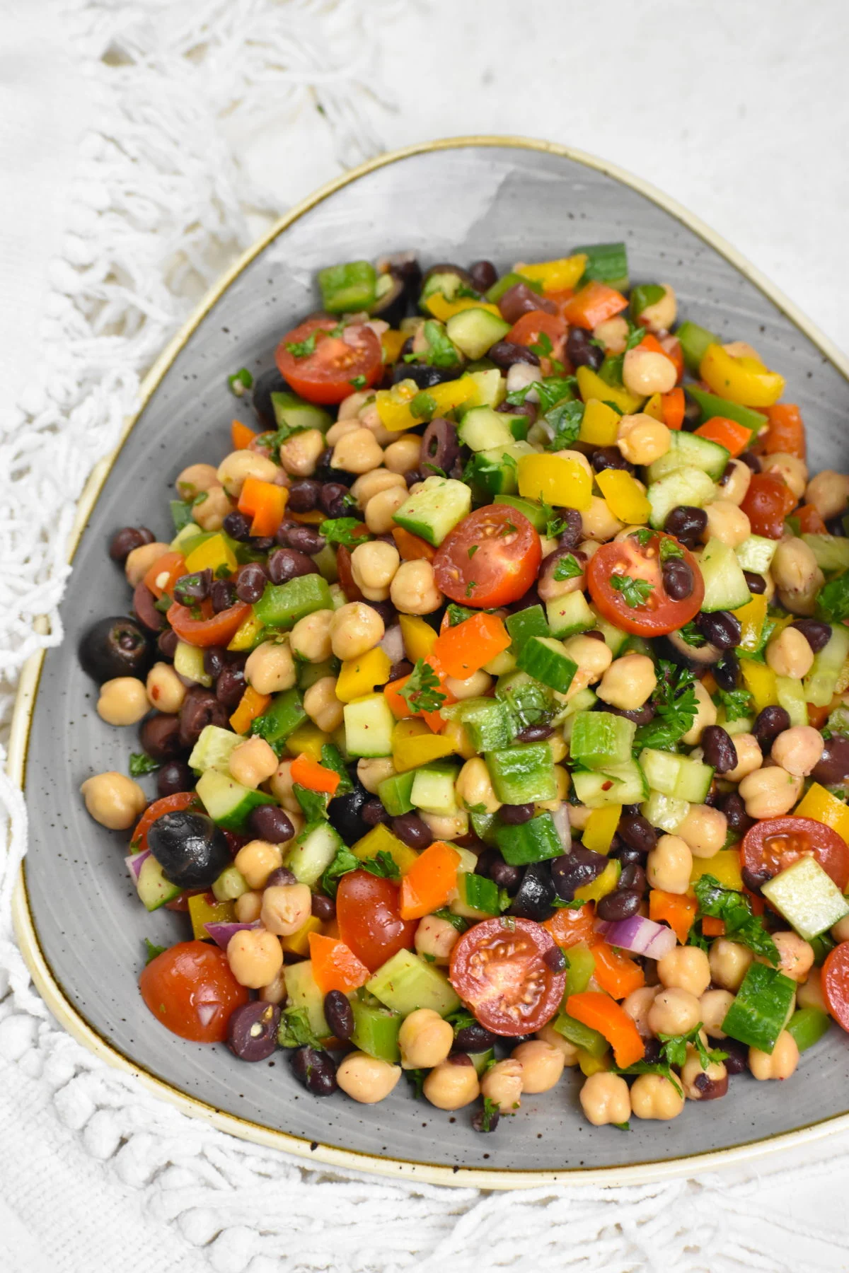 A bowl of balela salad.