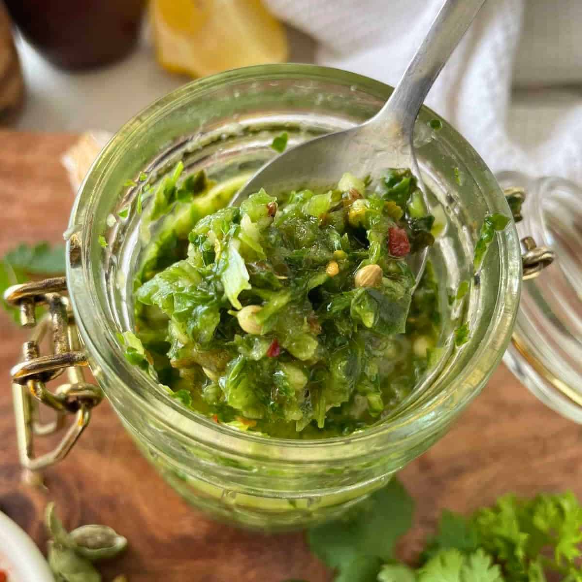 a jar of schug sauce.