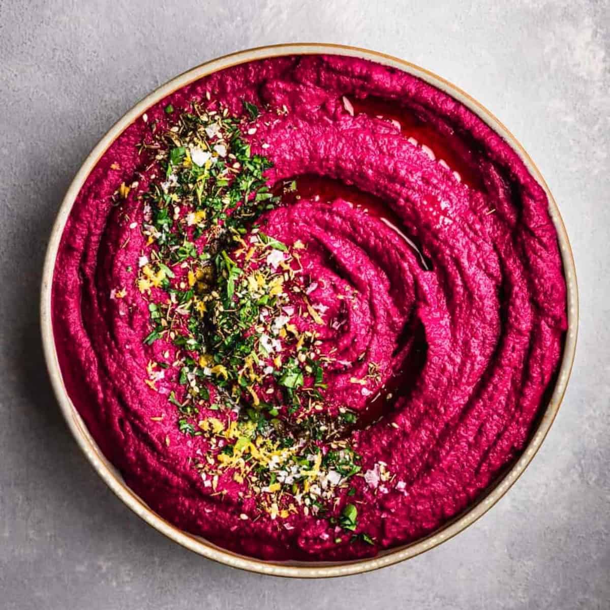 A bowl of beet hummus.
