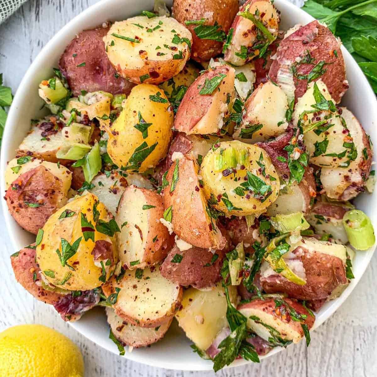 A serving bowl of vegan turkish potato salad.